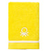 Toalla de tocador Benetton en color amarillo.